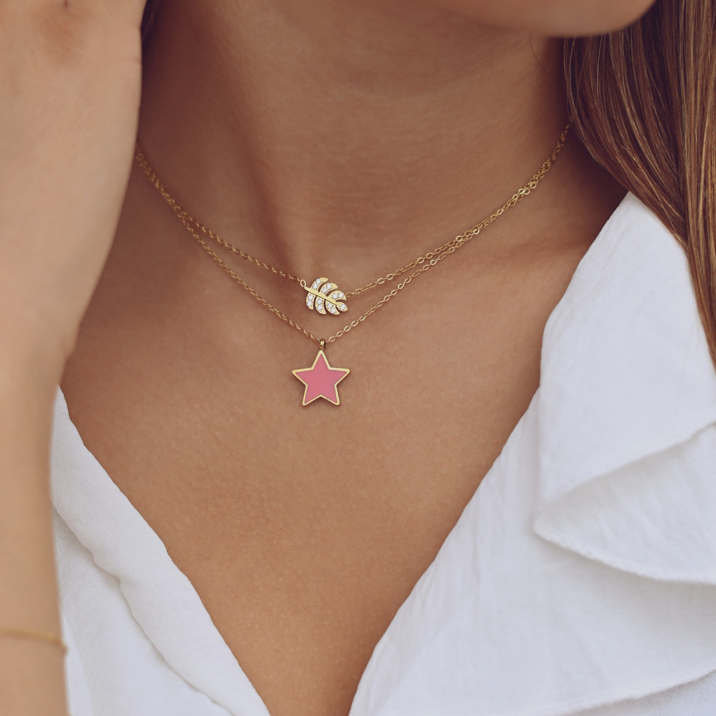 Collier en acier étoile rose